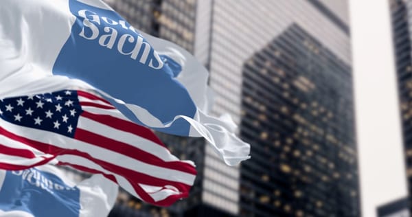 Die Goldman Sachs Fahne und die Amerikanische Flagge